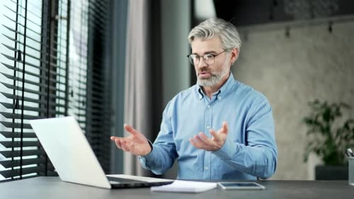 Man Discussing Online via Video Chat