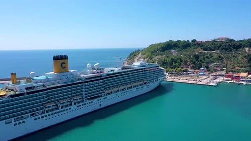 Mega Cruise ship docked in a port drone view of the side of the ship