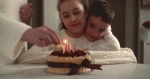 Lighting Birthday Candles with Family at Home