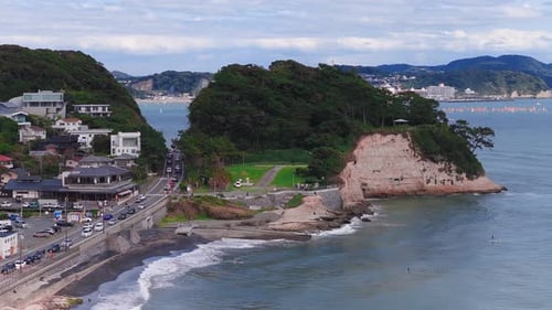 Aerial View of Kamakuro Coastline with Cliffs and Recreational Boats