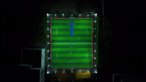 Aerial Night View of Modern Football Turf Stadium in Action