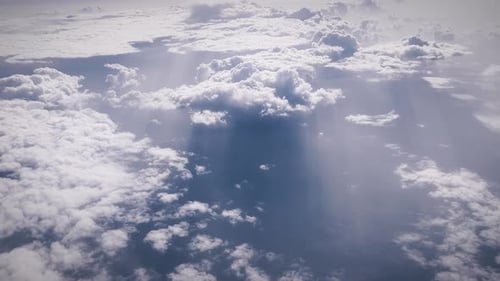 Aerial View of Fluffy Clouds and Blue Sky