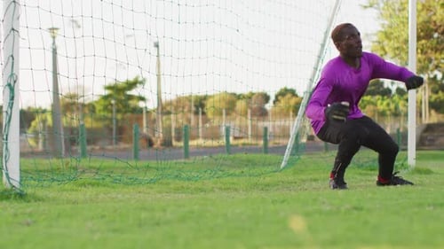 Video of african american football male goalkeeper with ball