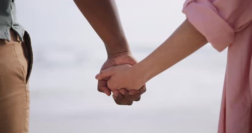 Beach, walking and couple holding hands on romantic date for love, support and travel