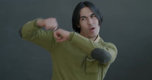 Young Adult Man Dancing and Smiling