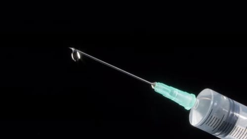 Single Drop at the Tip of Needle Syringe