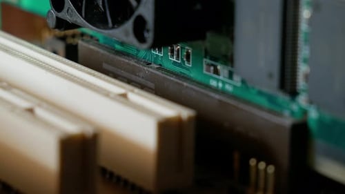 Installing a video adapter into a computer motherboard slot close-up