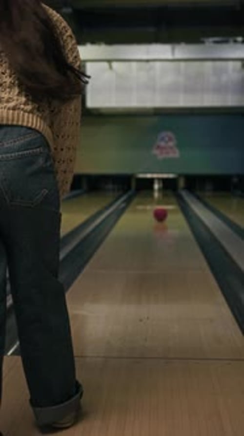 Girl Hitting Last Pin with Bowling Ball