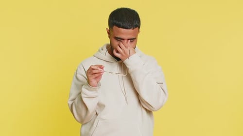 Man Puts On and Takes off Glasses