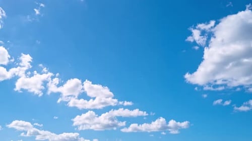 Clouds Drifting Across a Vibrant Blue Sky