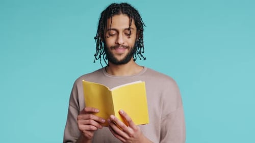 Man Reading Newly Released Hardcover Book From Publisher Studio Background