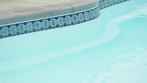 Outdoor hotel swimming pool without any people