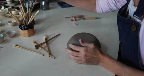 Hands View of Woman Making Ceramics Objects Inside Creative Pottery Studio -