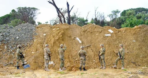 Rear view of Biracial military soldiers rifle training in fields during military training 4k