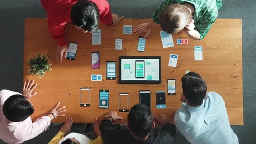 Top view of software developer team looking Ux design from tablet. Convocation.