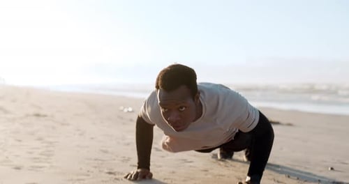 Black man, pushup and fitness exercise at beach, outdoor training and thinking with vision