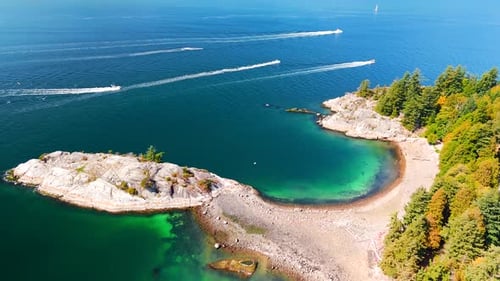 Aerial View of Several Speedboats on a Deep Blue Sea Near the Coast