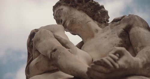 Low Angle Shot Of A Man And A Woman Sculpture (Cupid And Psyche-Like Statues)