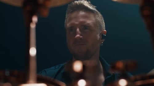 Rhythm and Groove Portrait of Professional Drummer at Rock Gig Man Playing Handsome Male Musician