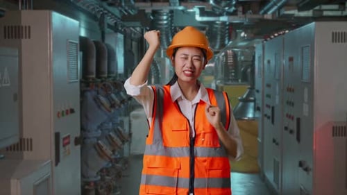 Asian Female Engineer Dancing Celebrating In Engine Control Room