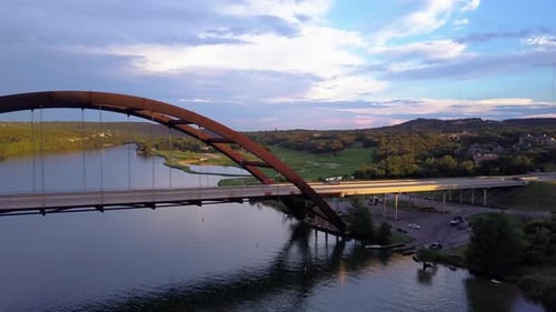 Flying over Pennybacker bridge to reveal Austin skyline