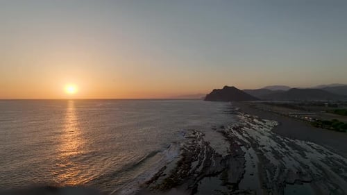 Aerial View Rocky Shoreline at Sunset Mediterranean Sea and Sky in Perfect Sync
