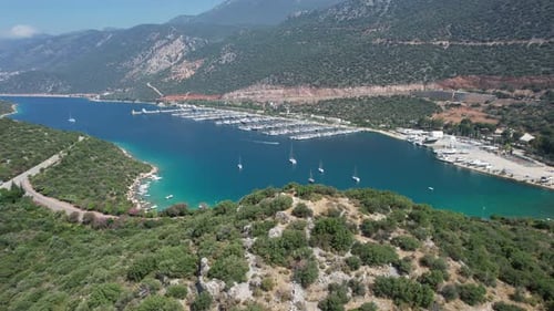 Drone shot of Kaş marina in Antalya region of Türkiye with blue waters