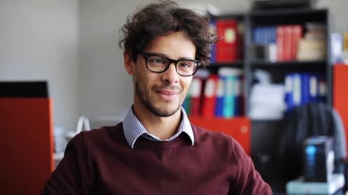 Smiling young man in an office environment