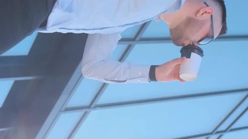 Male Businessman Drinking Coffee Near Office Center Lunch Break Delicious coffeeVertical Video