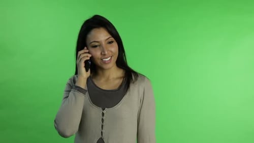 Casual woman isolated green screen confident with phone