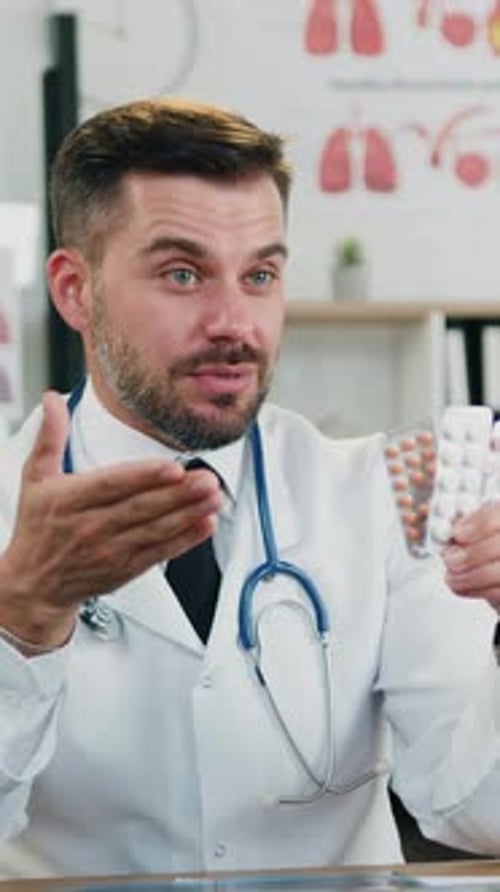 Close Up of Handsome Experienced Successful 35Aged Bearded Medic in White Coat Which Talking Into
