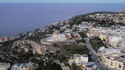 Aerial view of buildings on the coast, Malta.