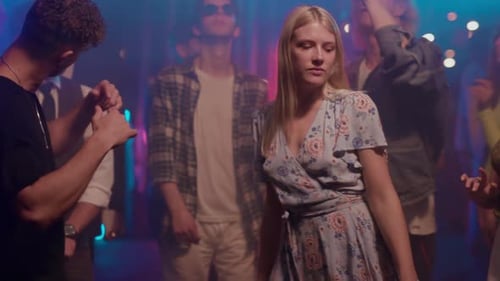 Young Adults Dancing Together at Night in a Club