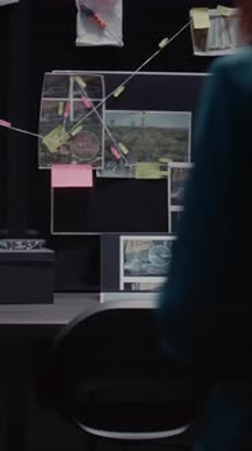 Detective Working Late at Desk in Office