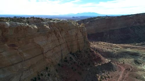 Beautiful aerial footage of canyons full of red rocks in utah