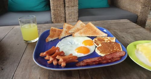 Breakfast Meal with Toast, Eggs, and Sausage