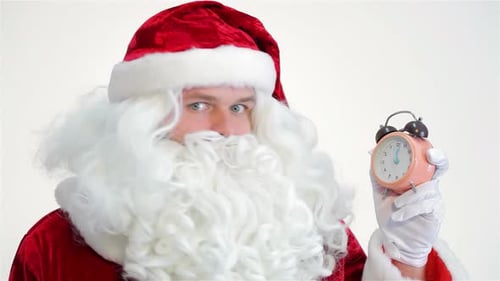 Santa Claus Points to Alarm Clock, Close Up