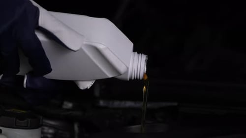 Adding Engine Oil to Car Engine