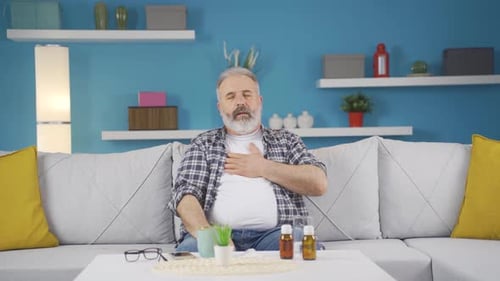 The sick man can't stop coughing.