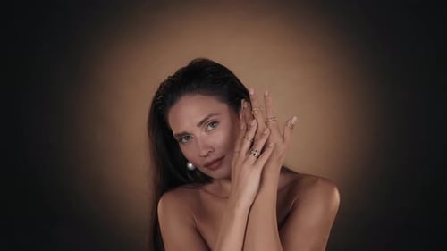 Woman Modeling Earrings and Rings