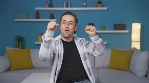 The man is dancing in a funny way.