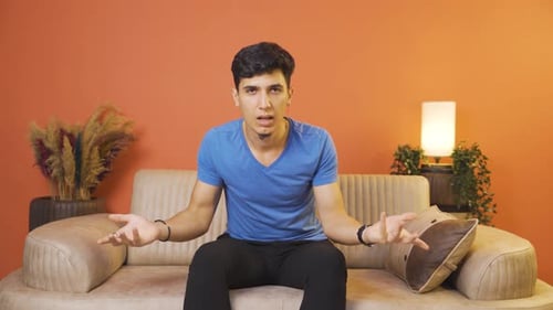 Man getting angry at camera.