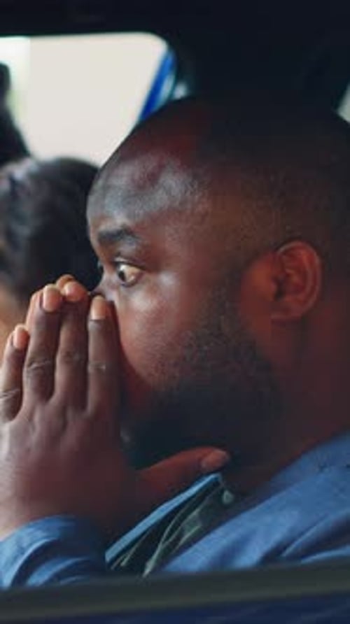 Close Up of Man Reacting in Car
