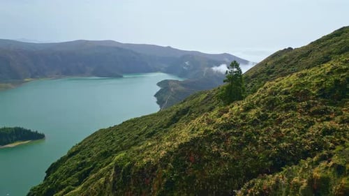 Summer Volcanic Island Panorama in Sunny Morning Clouds Covering Coast Hills