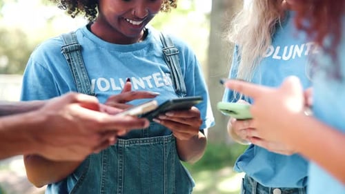 Park, volunteer and smartphone in group with smile for social media, teamwork or charity website