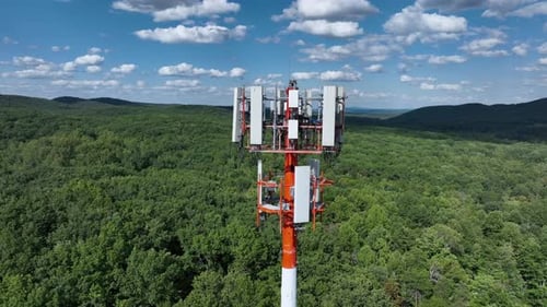 Aerial View of a Cell Transmission Tower in a Forest Landscape in the USA