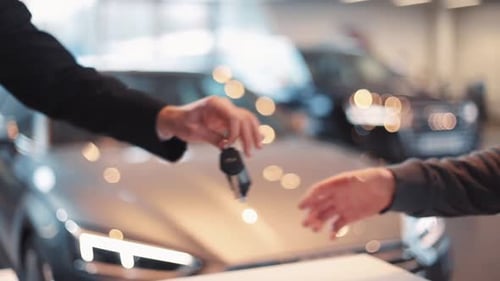 Seller of Machines Giving Keys to Buyer Men Shaking Hands Each Other in Car Dealership Making