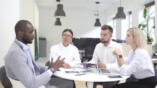 Multiethnic Business People During Meeting in Modern Office