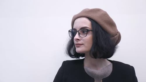 Woman Wearing Beret Looking Up and to Left