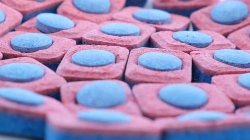 Close Up of Pink and Blue Dishwasher Pods